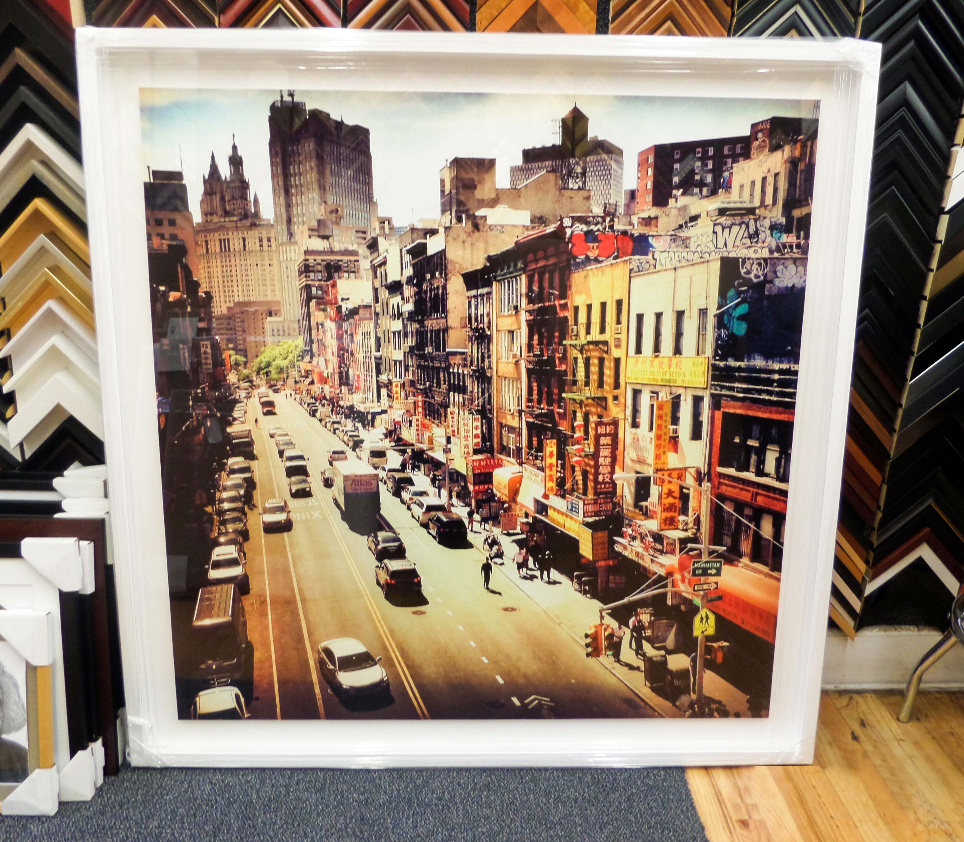 A Chinatown NYC street photograph framed in white